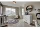 Bright Bedroom with crib, dresser, rocking chair, and stylish rug at 1163 Highview Dr, Erie, CO 80516