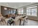 Inviting living room with modern decor, accent wall, and plenty of natural light at 1163 Highview Dr, Erie, CO 80516