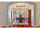 Traditional dining room with hardwood floors, a decorative ceiling, and a large window overlooking the outdoors at 7649 Pineridge Ter, Castle Pines, CO 80108