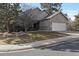 Charming home with a two-car garage, manicured lawn and stone accents at 7649 Pineridge Ter, Castle Pines, CO 80108