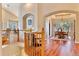 Spacious foyer with hardwood floors, archways, and elegant decor, creating a grand entrance to the home at 7649 Pineridge Ter, Castle Pines, CO 80108
