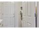 Bright laundry room with a door to the exterior, offering convenience and functionality for laundry tasks at 7649 Pineridge Ter, Castle Pines, CO 80108