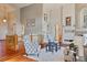 Open living area with hardwood floors, vaulted ceilings, elegant decor, and scenic outdoor views at 7649 Pineridge Ter, Castle Pines, CO 80108