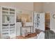 Spacious main bedroom featuring built-in shelving, a large mirror, and plenty of storage space at 7649 Pineridge Ter, Castle Pines, CO 80108