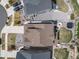 An aerial view of the home featuring a well maintained roof and backyard entertainment area at 23879 E Narrowleaf Pl, Aurora, CO 80016