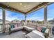 Spacious covered deck with comfortable lounge seating and neighborhood views at 23879 E Narrowleaf Pl, Aurora, CO 80016
