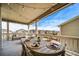 Outdoor deck setup with dining and relaxing furniture, perfect for entertaining at 23879 E Narrowleaf Pl, Aurora, CO 80016