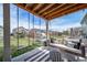 Relaxing outdoor space featuring a porch swing, playhouse, and well-manicured lawn for leisure and recreation at 23879 E Narrowleaf Pl, Aurora, CO 80016