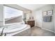 A luxurious bathroom features a soaking tub beneath a bright window at 23879 E Narrowleaf Pl, Aurora, CO 80016