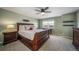Serene bedroom featuring a wooden bed frame, soft carpet, neutral walls, and lots of natural light at 23879 E Narrowleaf Pl, Aurora, CO 80016