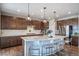 Spacious kitchen with granite countertops, stainless steel appliances, and a large center island at 23879 E Narrowleaf Pl, Aurora, CO 80016