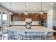 Modern kitchen featuring a large island, stainless steel appliances, and stylish pendant lighting at 23879 E Narrowleaf Pl, Aurora, CO 80016