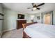 Inviting main bedroom boasting a wooden bed frame, soft carpet, neutral walls, and lots of natural light at 23879 E Narrowleaf Pl, Aurora, CO 80016