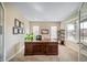 Bright office space with ample natural light, a large desk, and a cozy work environment at 23879 E Narrowleaf Pl, Aurora, CO 80016