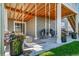 Covered patio featuring outdoor seating, string lights, ceiling fans, and wood beams perfect for entertaining guests at 23879 E Narrowleaf Pl, Aurora, CO 80016