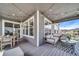 Inviting covered patio with stylish furniture, string lights, and an outdoor dining area, perfect for entertaining at 23879 E Narrowleaf Pl, Aurora, CO 80016
