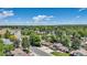 Aerial view showcasing the property's location within a neighborhood surrounded by lush greenery at 8272 Ammons Cir, Arvada, CO 80005