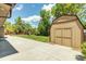 Spacious backyard featuring a storage shed, lush lawn, and play area, perfect for outdoor activities at 8272 Ammons Cir, Arvada, CO 80005
