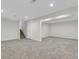 Spacious finished basement with recessed lighting, carpet, and plenty of room for recreation and storage at 8272 Ammons Cir, Arvada, CO 80005