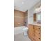 Bathroom with a shower over tub, tiled walls, vanity with drawers, and contemporary fixtures at 8272 Ammons Cir, Arvada, CO 80005