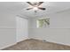 Bright bedroom featuring large closet, a ceiling fan, and a window letting in plenty of natural light at 8272 Ammons Cir, Arvada, CO 80005