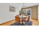 Cozy dining area with hardwood floors, modern lighting, and access to the backyard at 8272 Ammons Cir, Arvada, CO 80005