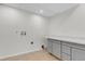 Bright laundry room features utility sink, storage, and natural light at 8272 Ammons Cir, Arvada, CO 80005