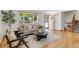Bright and airy living room with hardwood floors, a large window, and stylish furnishings at 8272 Ammons Cir, Arvada, CO 80005