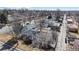 Aerial view of a home in a tree-lined neighborhood, showcasing the roof and surrounding streets at 6330 E 13Th Ave, Denver, CO 80220