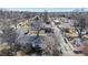 Bird's eye view of a home with trees and a neighborhood setting under a blue sky at 6330 E 13Th Ave, Denver, CO 80220