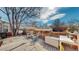 Wooden deck with outdoor seating and a fenced yard provides a peaceful outdoor space at 6330 E 13Th Ave, Denver, CO 80220