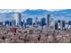 City skyline view showcasing the skyscrapers of the city set against a mountain backdrop at 6330 E 13Th Ave, Denver, CO 80220