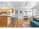Open-concept living space featuring a kitchen counter and hardwood floors at 6330 E 13Th Ave, Denver, CO 80220