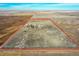 Aerial view of the property for sale, highlighting the expansive acreage and buildings inside the red property outline at 48155 E 56Th Ave, Bennett, CO 80102