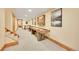 Finished basement with a shuffleboard table and plenty of space for recreation at 48155 E 56Th Ave, Bennett, CO 80102