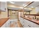 Basement bathroom featuring a walk in shower, toilet and a double sink vanity with copper basins at 48155 E 56Th Ave, Bennett, CO 80102
