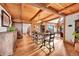Elegant dining area features wood floors, exposed beams, and seamless access to living spaces at 48155 E 56Th Ave, Bennett, CO 80102