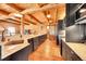 Spacious kitchen with stainless steel appliances, a large island, and wood beam accents at 48155 E 56Th Ave, Bennett, CO 80102