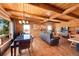 Open floor plan features living room, dining area, wood floors, and plenty of natural light at 48155 E 56Th Ave, Bennett, CO 80102