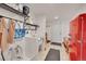 Functional mud room with utility sink, white subway tile, and ample storage at 48155 E 56Th Ave, Bennett, CO 80102