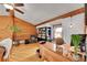 Home office with built-in bookshelves, wood floors, and natural light at 48155 E 56Th Ave, Bennett, CO 80102