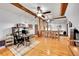 Open office space with hardwood floors, exposed wood beams, and lots of natural light at 48155 E 56Th Ave, Bennett, CO 80102
