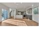 Bright, open kitchen with stainless steel appliances, gray cabinets, hardwood floors, and ample counter space at 3186 Springmeadow Cir, Castle Rock, CO 80109