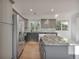 A kitchen featuring stainless steel appliances, gray cabinets, granite countertops, and hardwood floors at 3186 Springmeadow Cir, Castle Rock, CO 80109