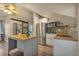 Cozy living space featuring a small kitchen area equipped with stainless steel appliances at 3186 Springmeadow Cir, Castle Rock, CO 80109