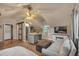 Compact living room with full bed, sofa and kitchen and in unit laundry at 3186 Springmeadow Cir, Castle Rock, CO 80109