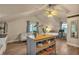 Cozy living space featuring a small kitchen area equipped with stainless steel appliances and a sofa at 3186 Springmeadow Cir, Castle Rock, CO 80109