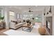Bright living room with neutral decor, a fireplace, and sliding glass doors to the backyard at 3186 Springmeadow Cir, Castle Rock, CO 80109