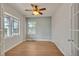 Bright, versatile home office space featuring hardwood floors and large windows with plenty of natural light at 3186 Springmeadow Cir, Castle Rock, CO 80109