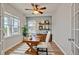 Comfortable home office with a wooden desk, ceiling fan, natural light, and stylish decor at 3186 Springmeadow Cir, Castle Rock, CO 80109